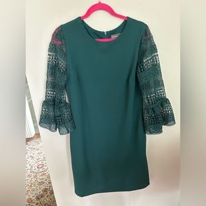 Emerald green knee length dress with 3/4 sheer lace bell sleeve.